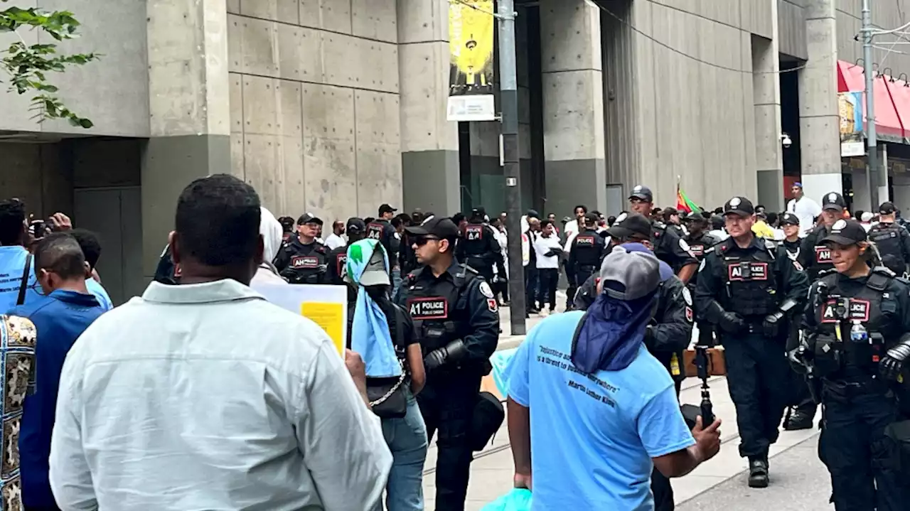 Toronto police block downtown roads as two opposing groups protest