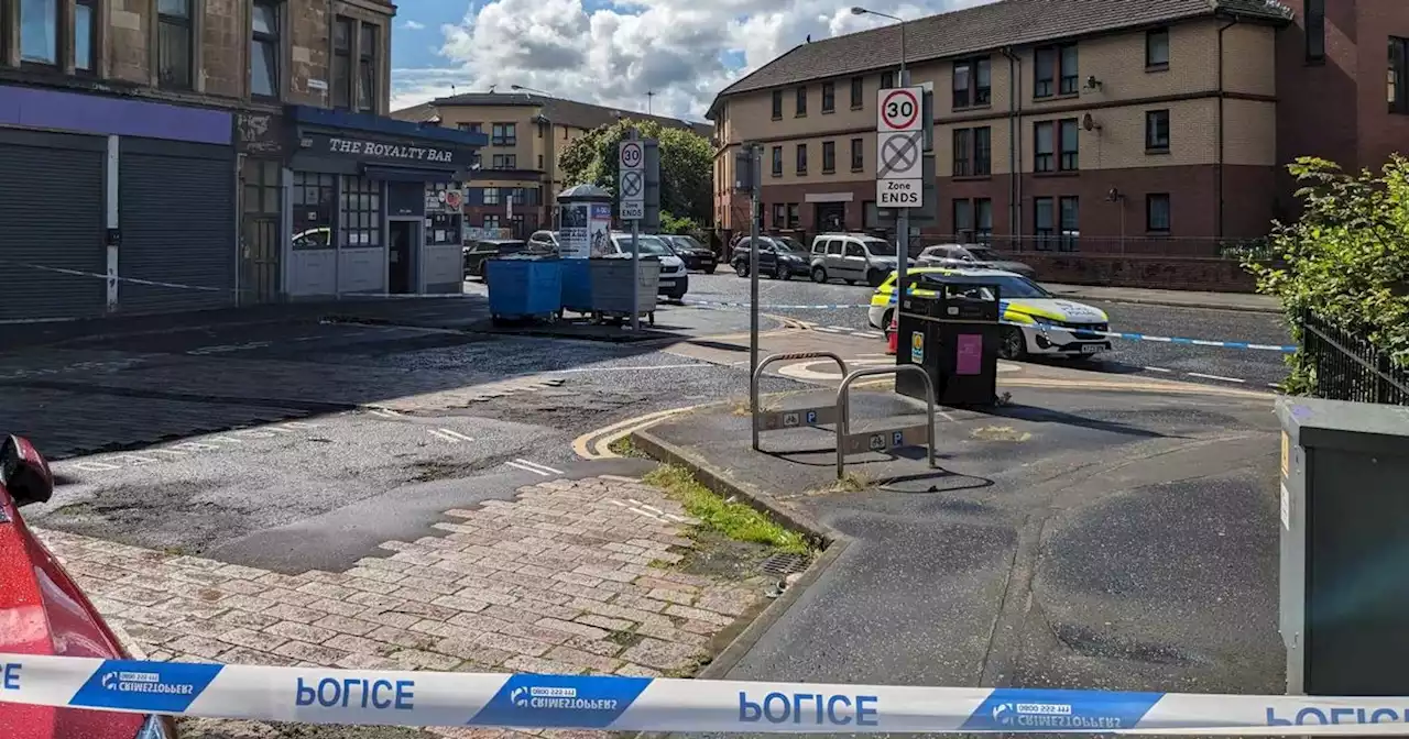 Glasgow street taped off by police in west end as woman rushed to hospital