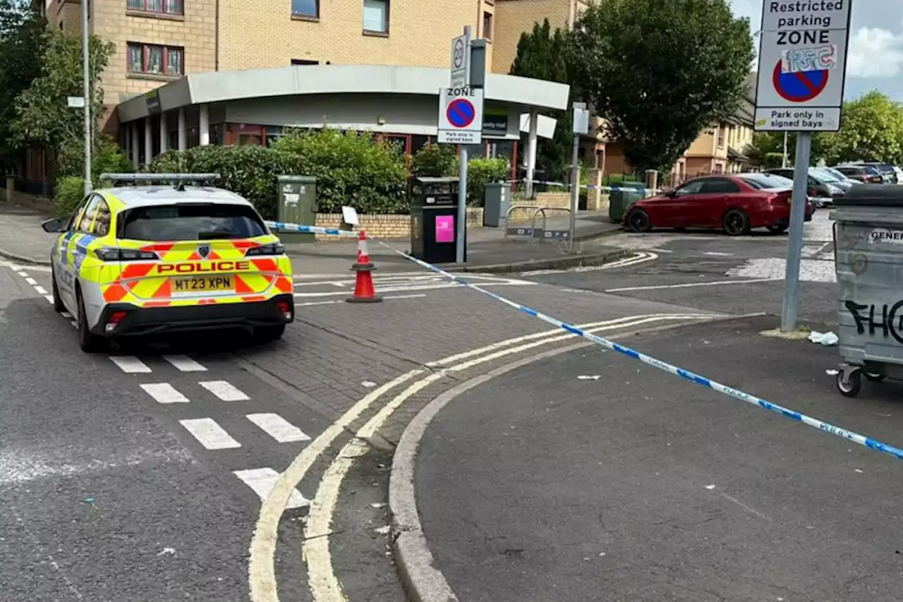 Woman hospitalised as Glasgow street taped off after incident