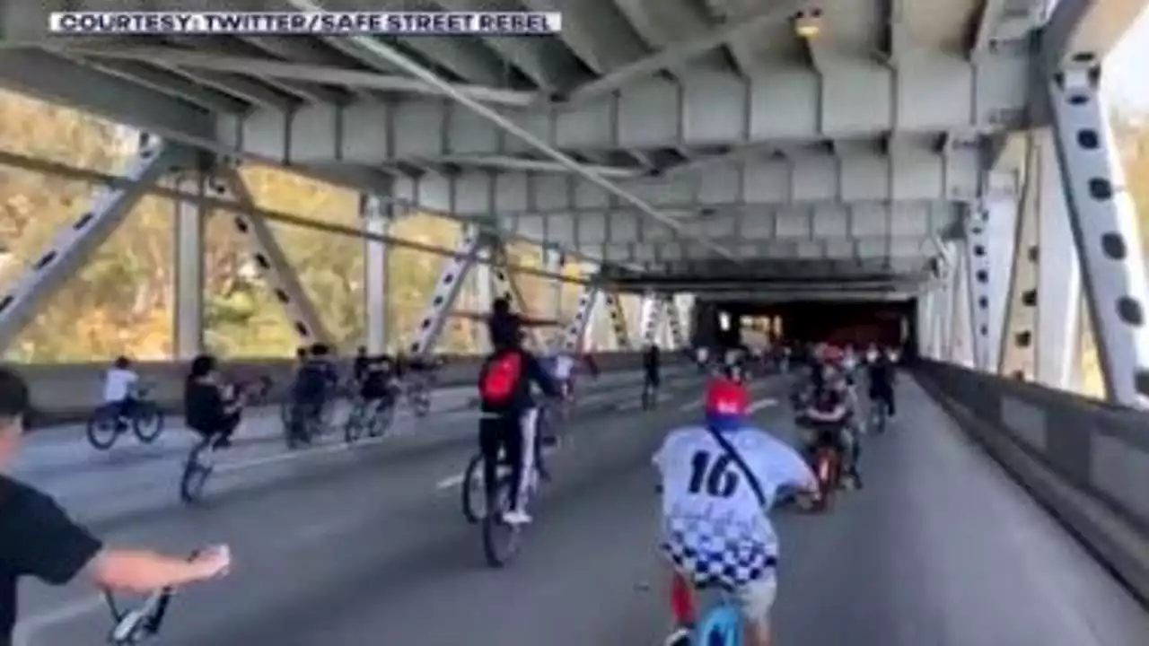 Large group of young bicyclists takeover Bay Bridge