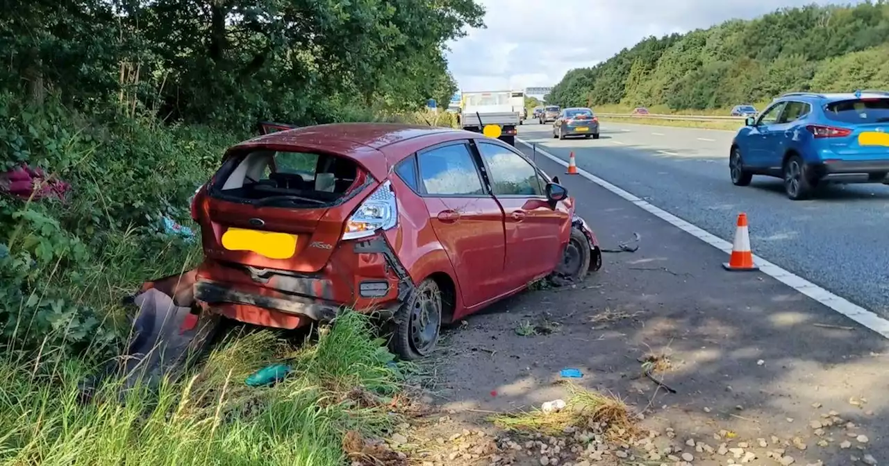 Car smashes off M56 trying to avoid ladder that fell from van in front