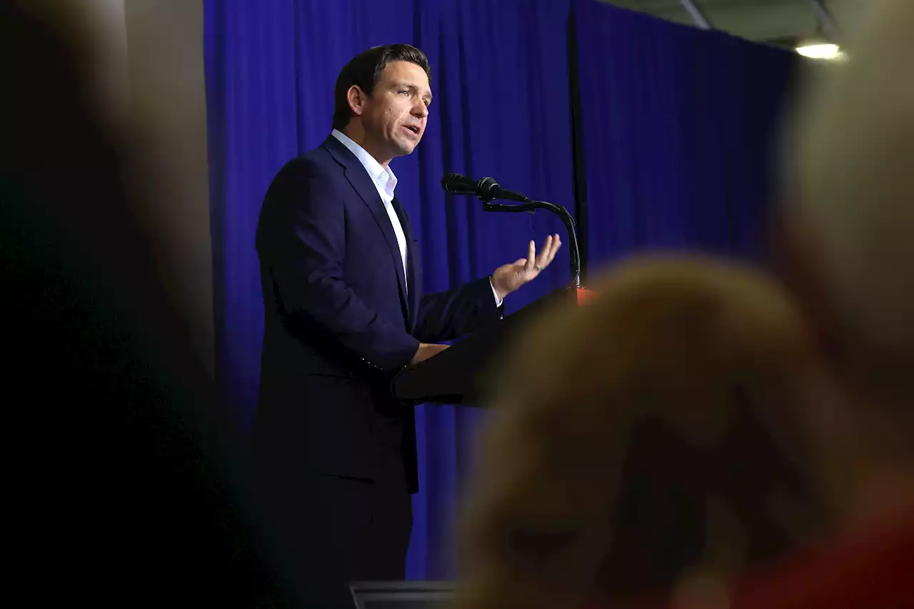 DeSantis Confronted with Trump Signs at Iowa Rally