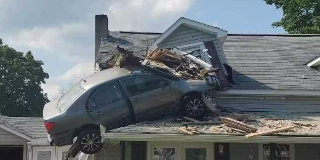 Car flies through second floor of house