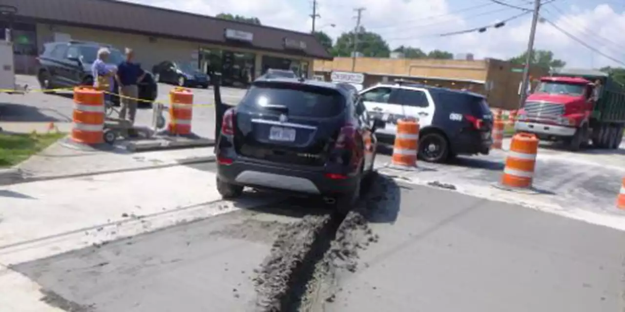 PHOTOS: Rocky River driver stuck after steering car into wet concrete