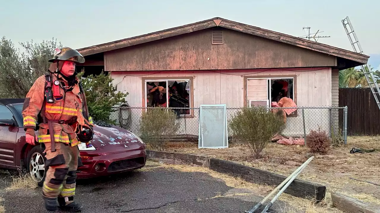 Woman pulled from Phoenix house fire is fighting for her life