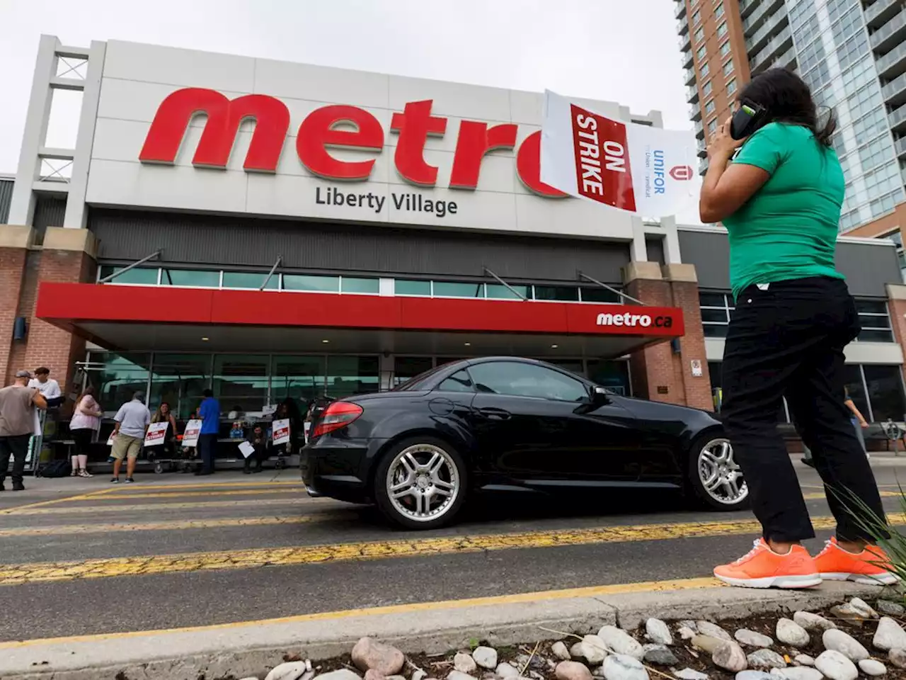 Striking workers demand 'fair share' as Metro reports better-than-expected profits