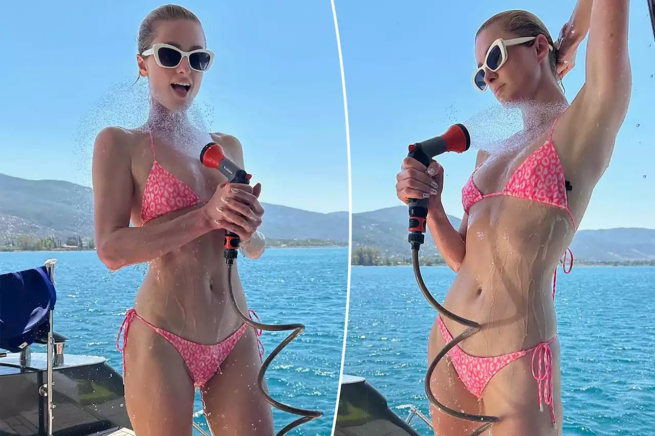 'Bikini Barbie' Paris Hilton Hoses Down in a Leopard Swimsuit While Vacationing in Greece