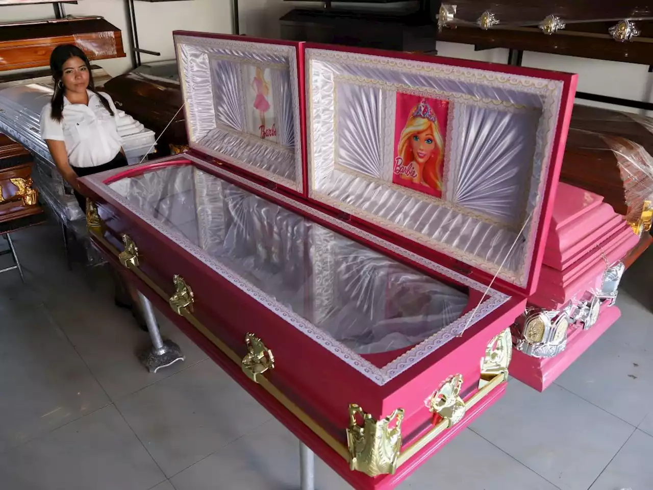 A funeral home in El Salvador is selling hot pink Barbie-themed coffins because the owner wants to 'jump on' the movie's success