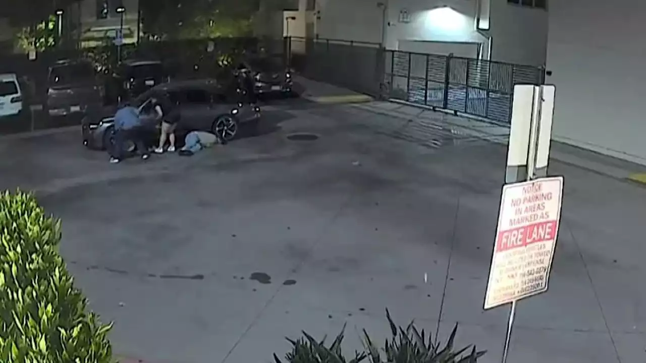 Watch: Man robbed at gunpoint as he changed tire in Santa Ana