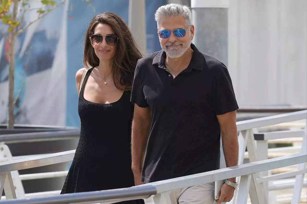 George Clooney and Amal Clooney Hold Hands as They Leave Venice After Her DVF Awards Honor