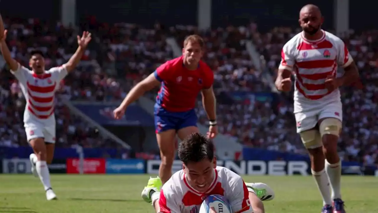 Japan down brave Chile to take World Cup Pool D lead