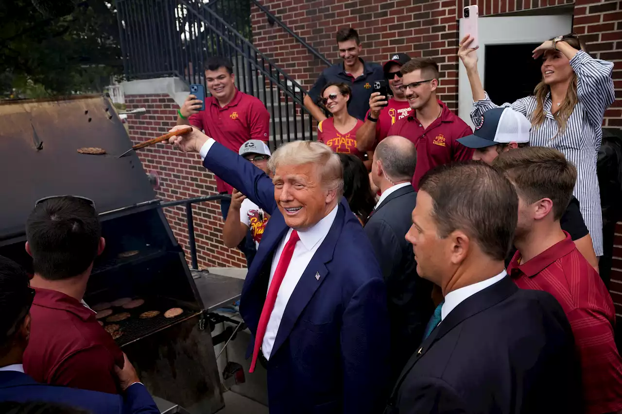 Trump stops at a fraternity house as he draws praise and protest during Iowa visit