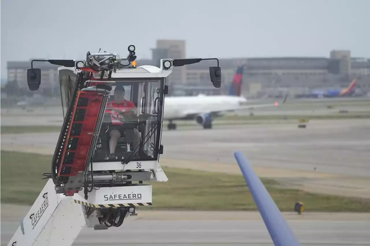 Delta Air Lines employees work up a sweat at boot camp, learning how to deice planes