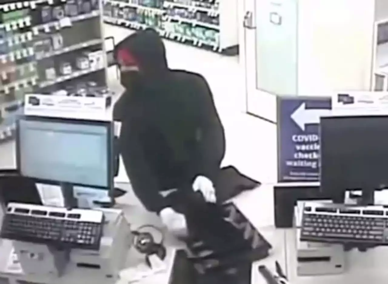 VIDEO: Masked man stuffs bag with codeine, oxycodone and money at west Houston drug store