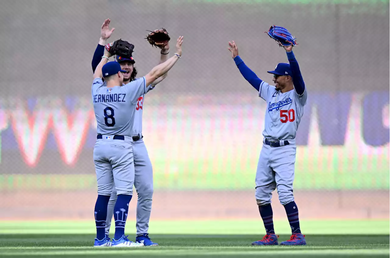 Dodgers outlast rain, defeat Nationals 7-3 to extend NL West lead to 13 games