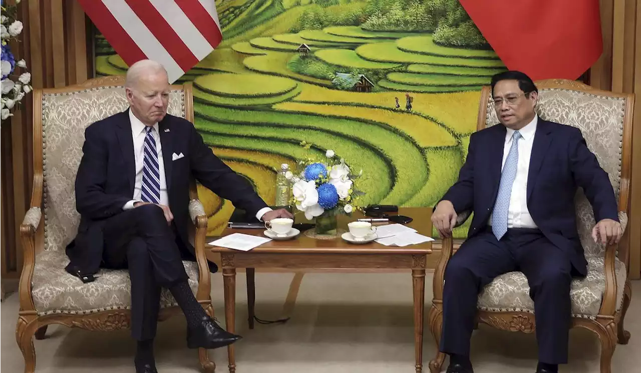 Biden highlights business deals and pays respects at John McCain memorial to wrap up Vietnam visit