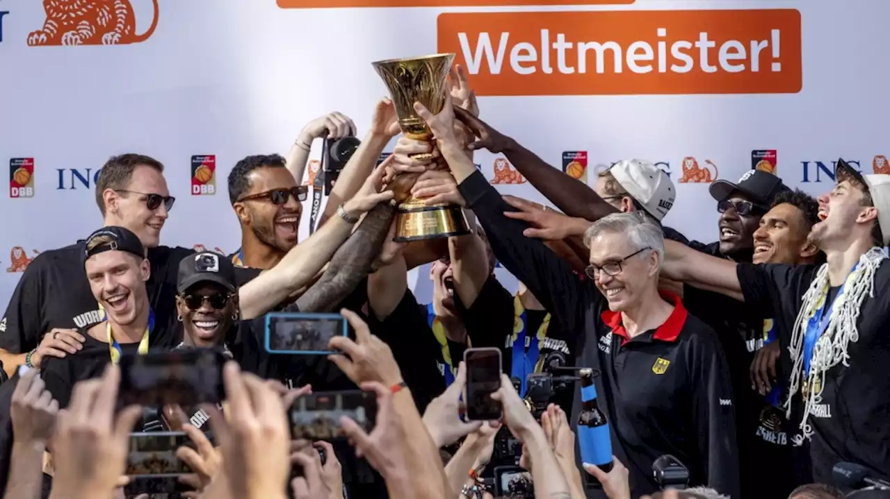 Fans cheer German basketball team's return home after winning World Cup title