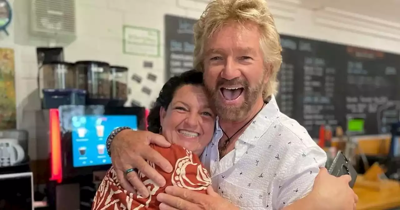 Noel Edmonds' spotted serving coffee to cafe customers