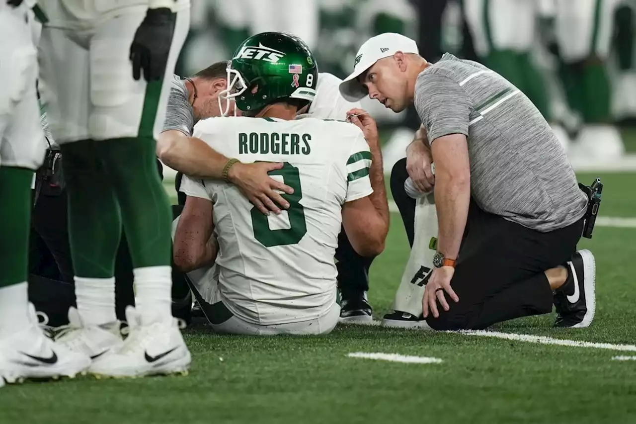 Aaron Rodgers hurts ankle in first series for Jets, is carted off sideline and ruled out of game