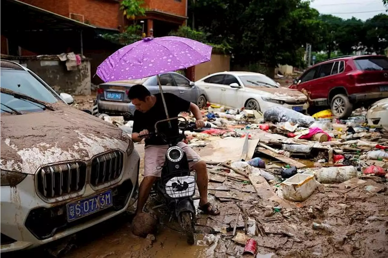 Unrelenting rain causes more than 100 landslides, traps residents in flood waters in southern China