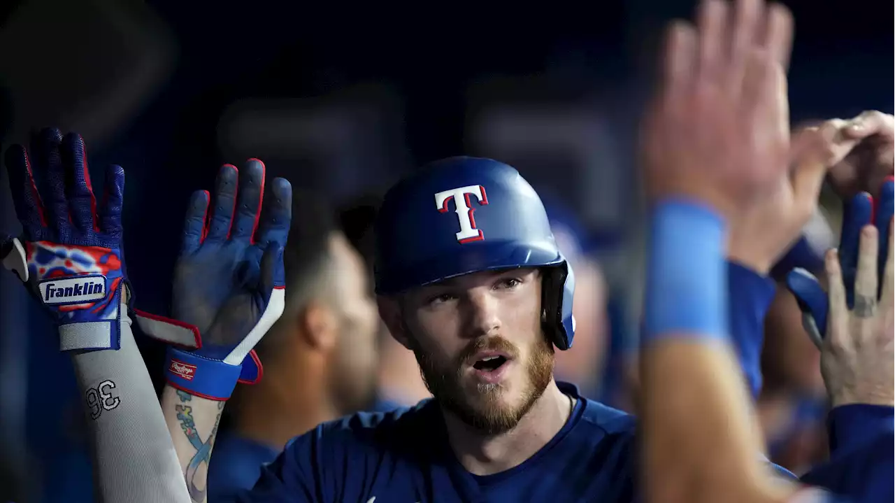 Heim hits grand slam as Rangers dump Blue Jays in opener of key four-game series