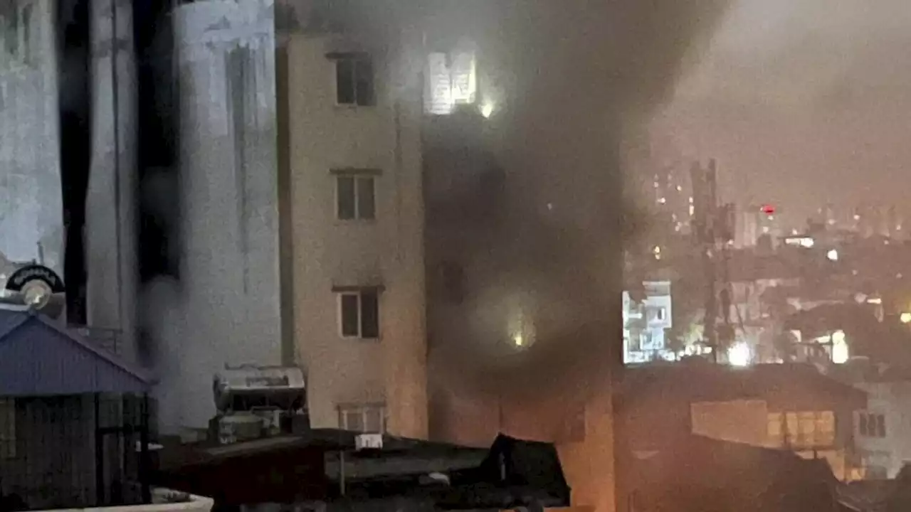 More than a dozen people are feared dead in a massive fire at an apartment building in Hanoi