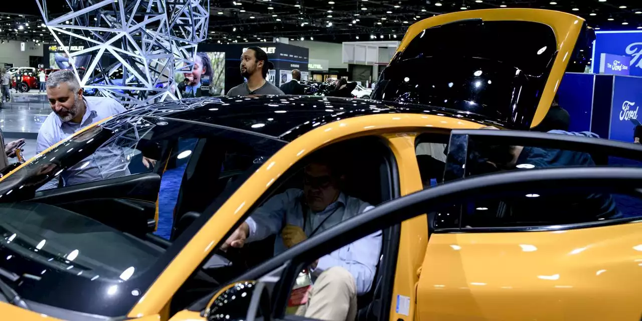 In Detroit, UAW’s Strike Threat Overshadows a Shrunken Auto Show