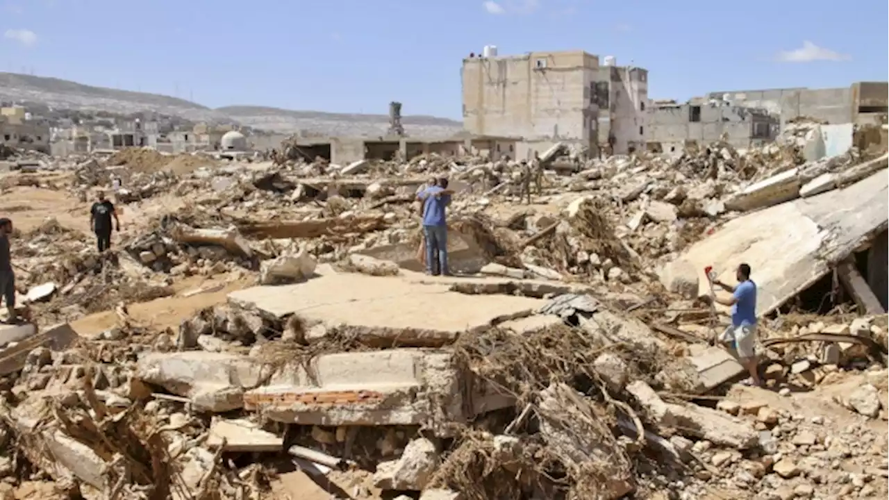 Libyan city buries thousands in mass graves after flood, while mayor says death toll could triple