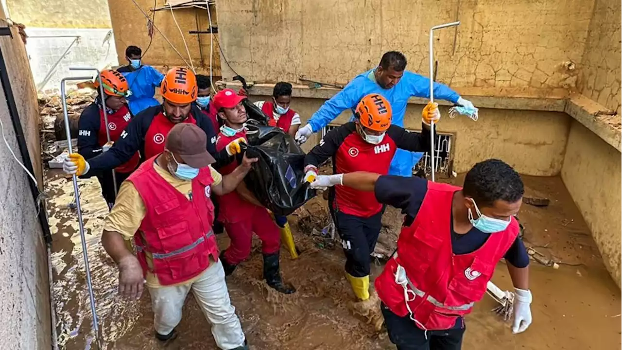 Libyan city buries thousands in mass graves after flood, while mayor says death toll could triple