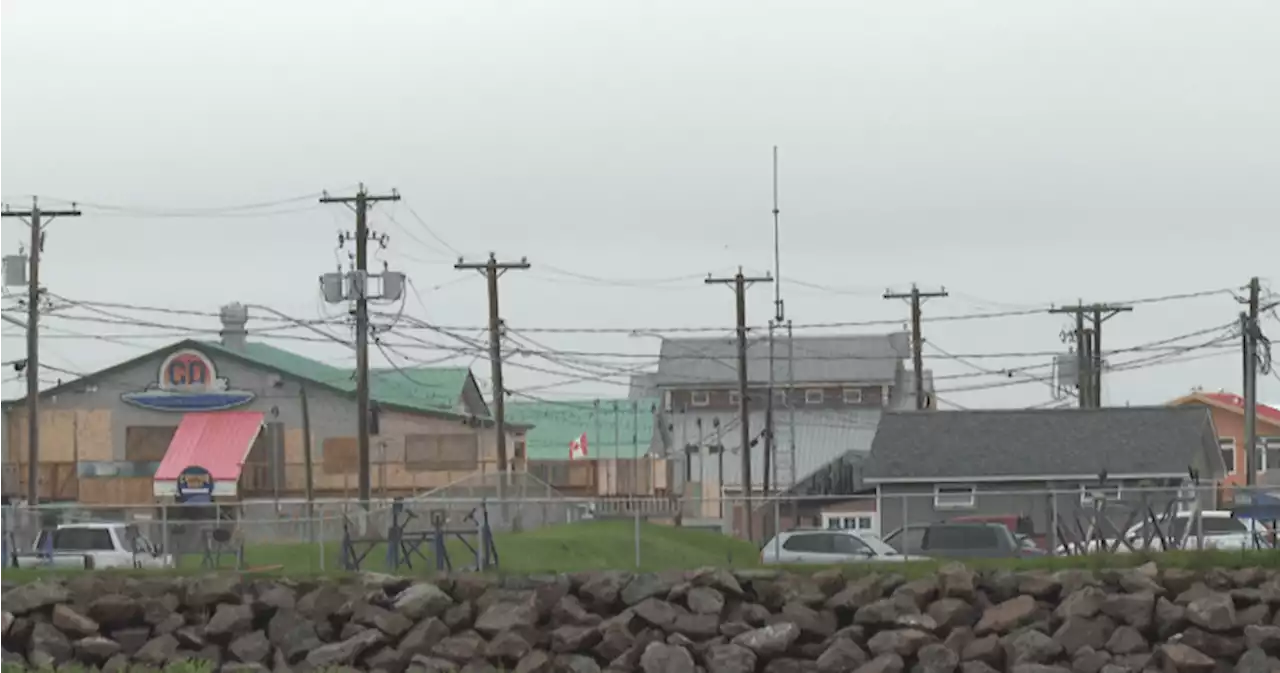 Battening down the hatches at the Pointe-du-Chêne wharf in preparation for Hurricane Lee