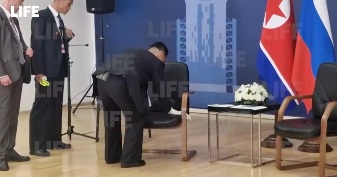 Kim Jong Un's security rush to wipe down his chair during talks with Putin