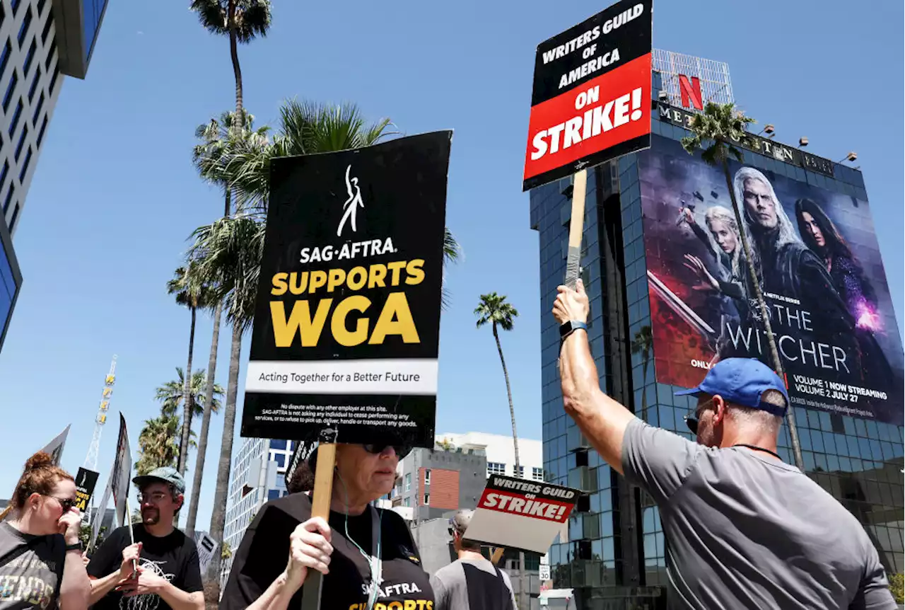 Striking actors, writers swarm Hollywood in massive solidarity march