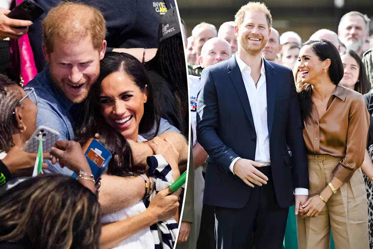 Prince Harry and Meghan Markle play up the PDA at Invictus Games: ‘Love loudly’