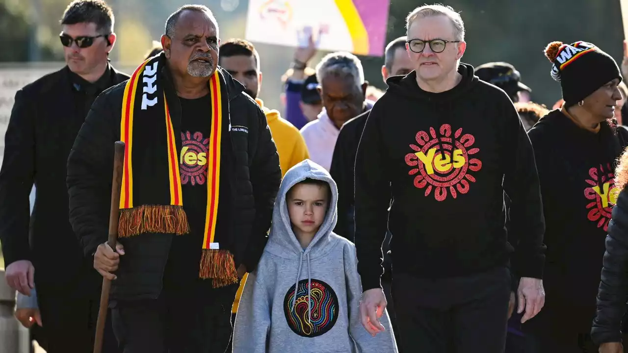 Michael Long completes historic walk to parliament for Voice as PM joins final leg