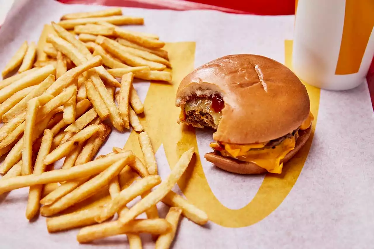 McDonald's is selling 50-cent double cheeseburgers for National Cheeseburger Day, Wendy's is giving them out for a penny