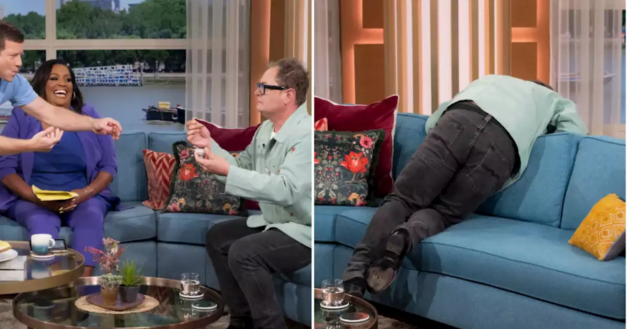 Alan Carr apologises for 'being sick' live behind This Morning sofa