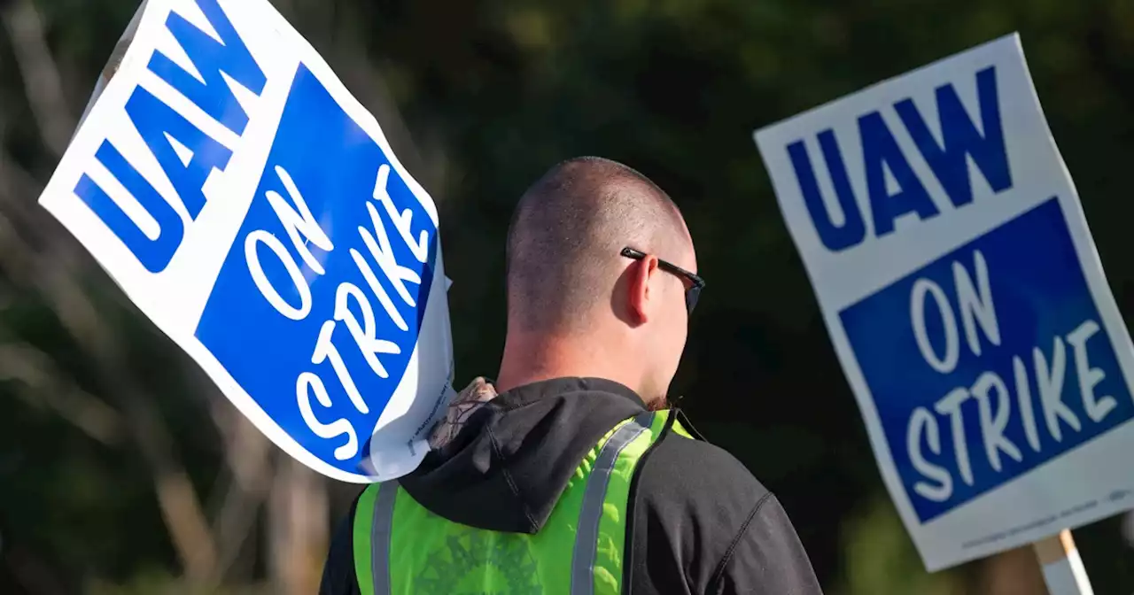 Striking autoworkers want to end a system that pays different wages for the same job