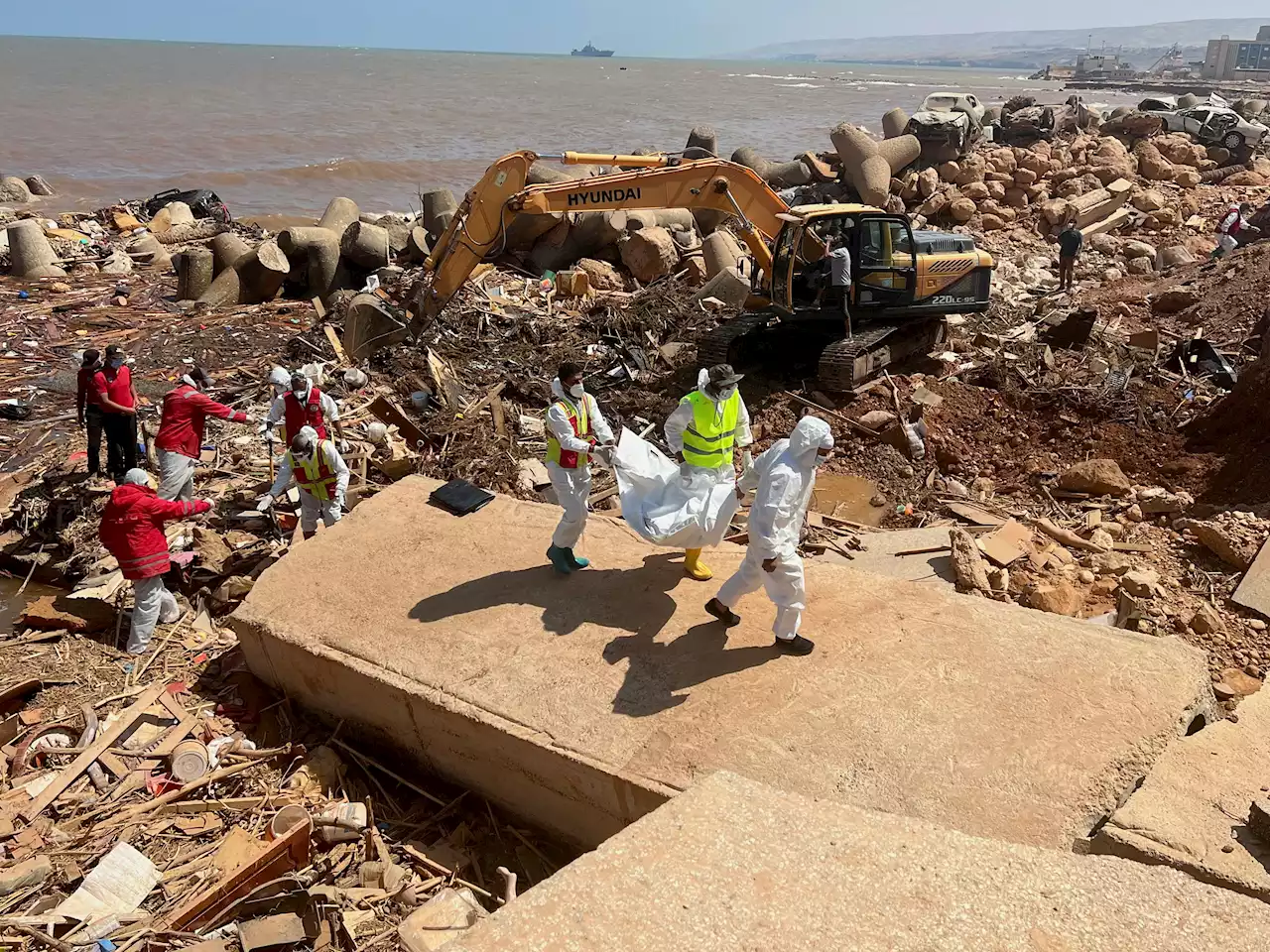 Flood-hit Libyan city counts losses as search for missing goes on