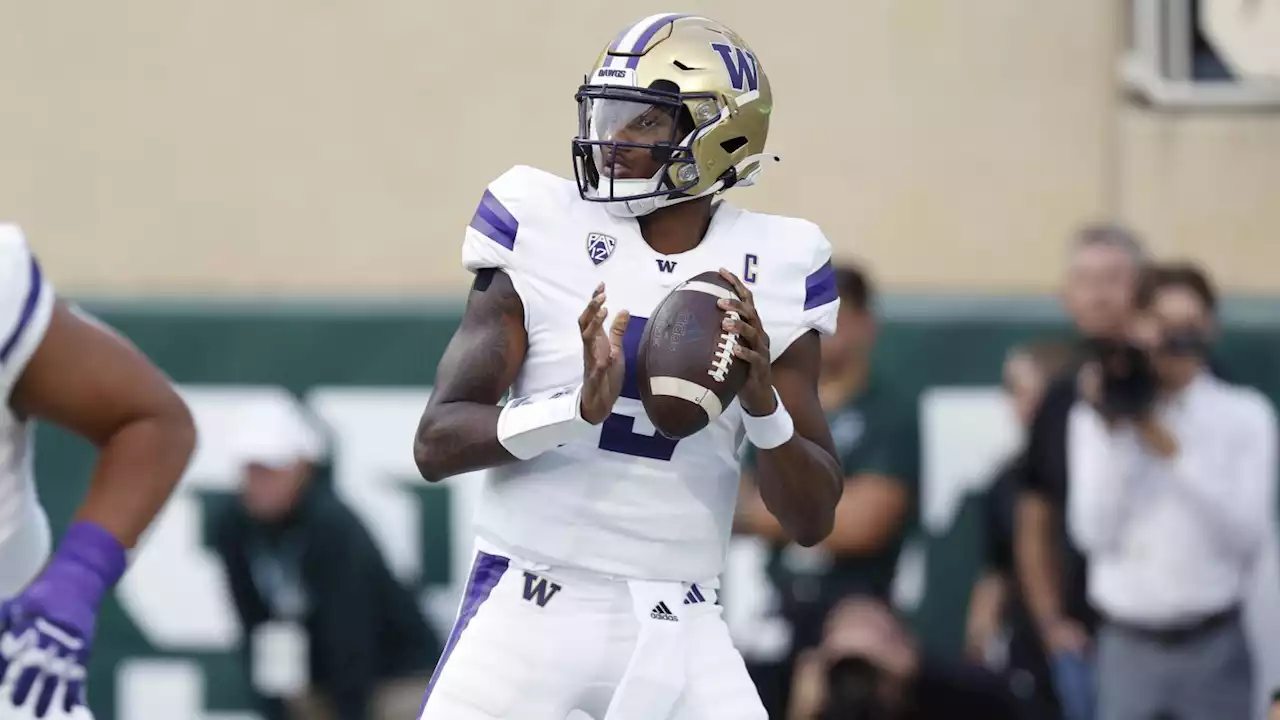 Penix leads No. 8 Washington in 41-7 rout of Michigan State, playing without suspended coach