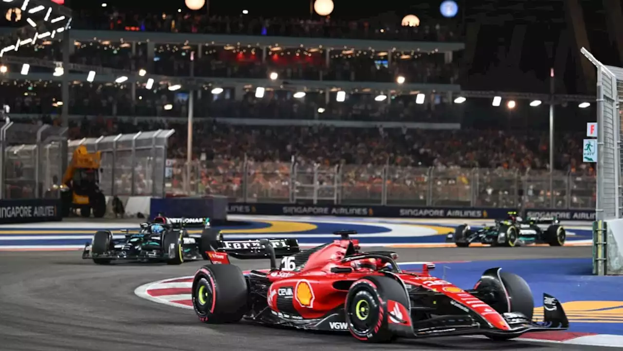 Motor racing-Ferrari's Carolos Sainz wins in Singapore to end Red Bull's run