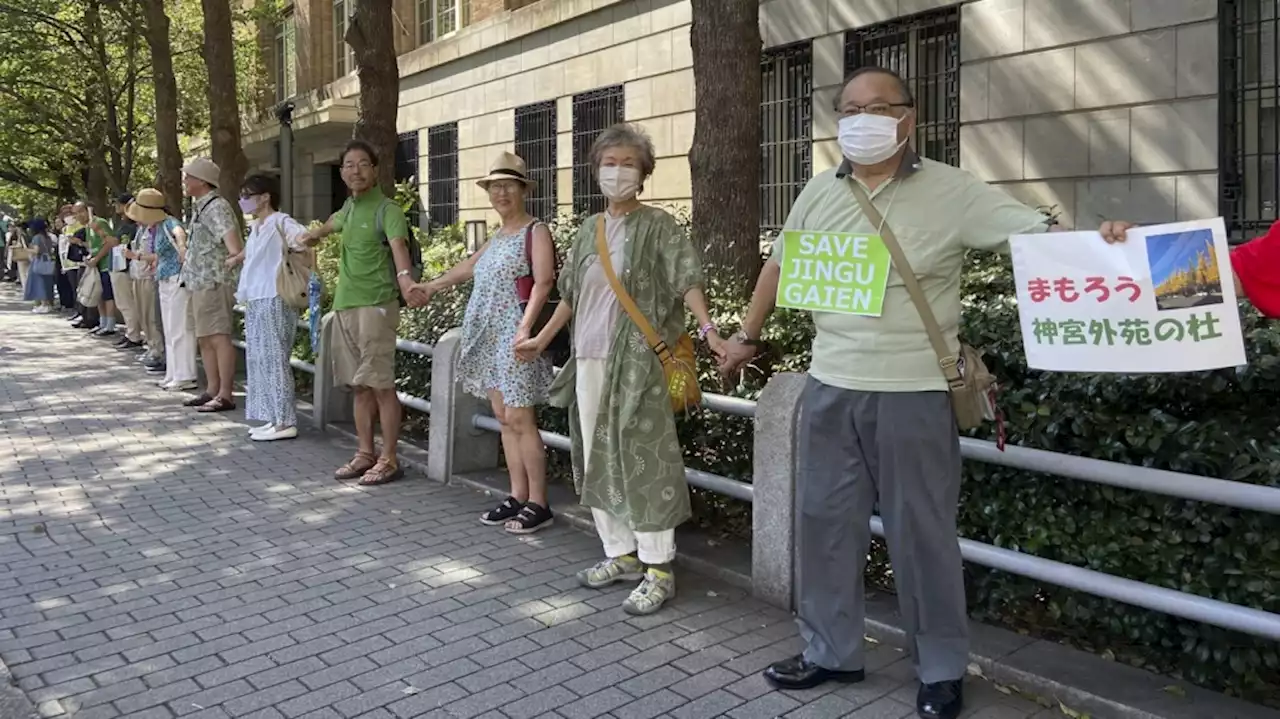 Protesters demand that Japan save thousands of trees by revising a design plan for a popular Tokyo park