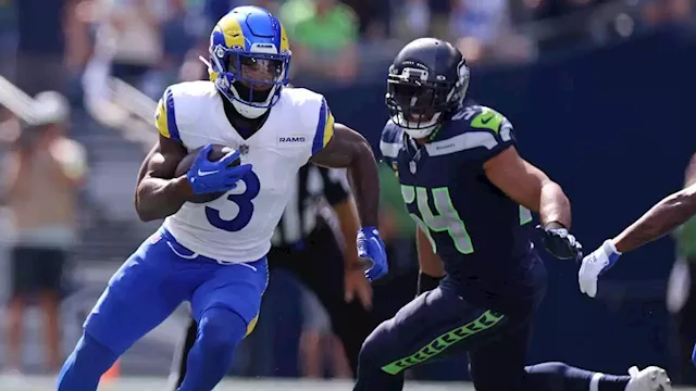 San Francisco 49ers quarterback Brock Purdy, right, passes as Los Angeles  Rams linebacker Michael Hoecht runs in during the first half of an NFL  football game Sunday, Sept. 17, 2023, in Inglewood