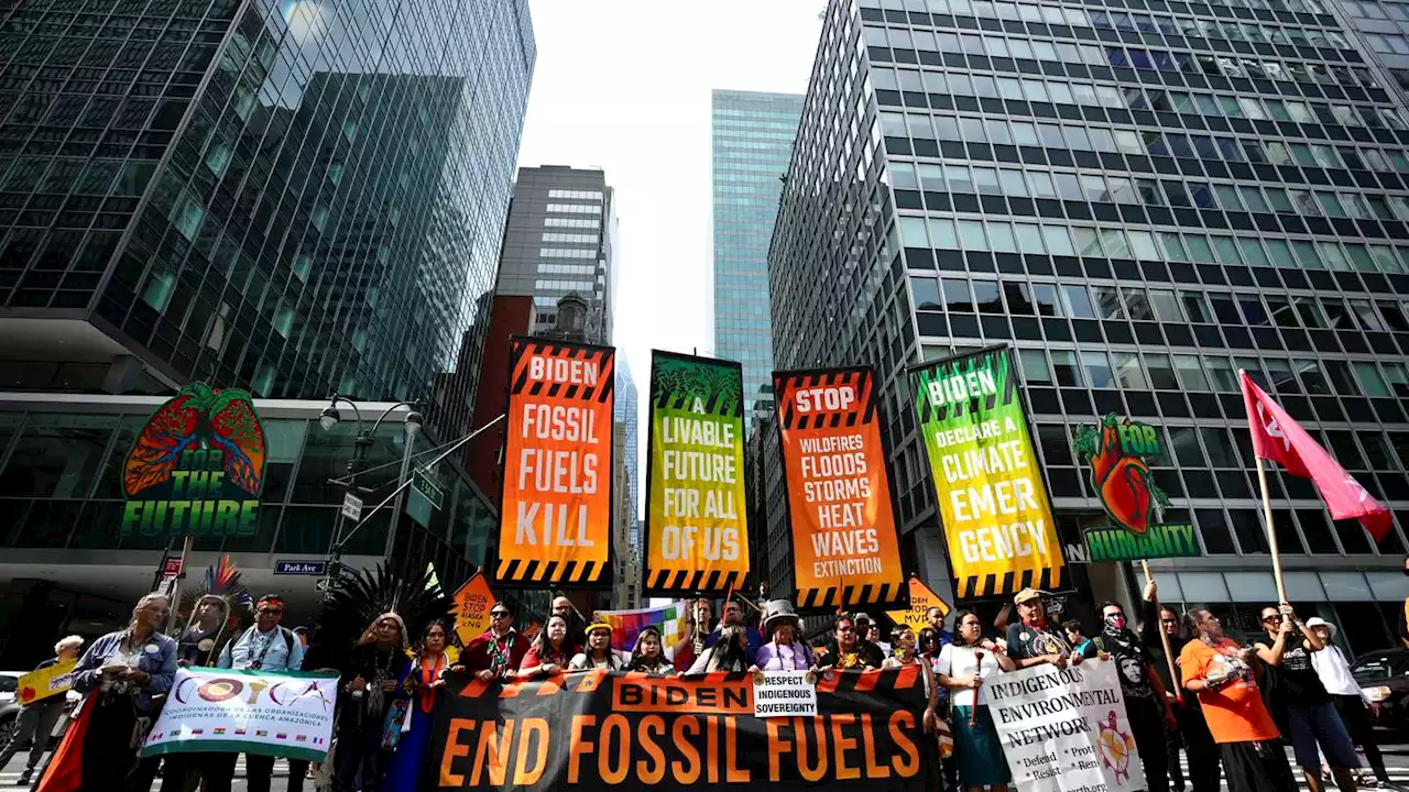 Thousands march to kick off climate summit, demanding an end to warming-causing fossil fuels