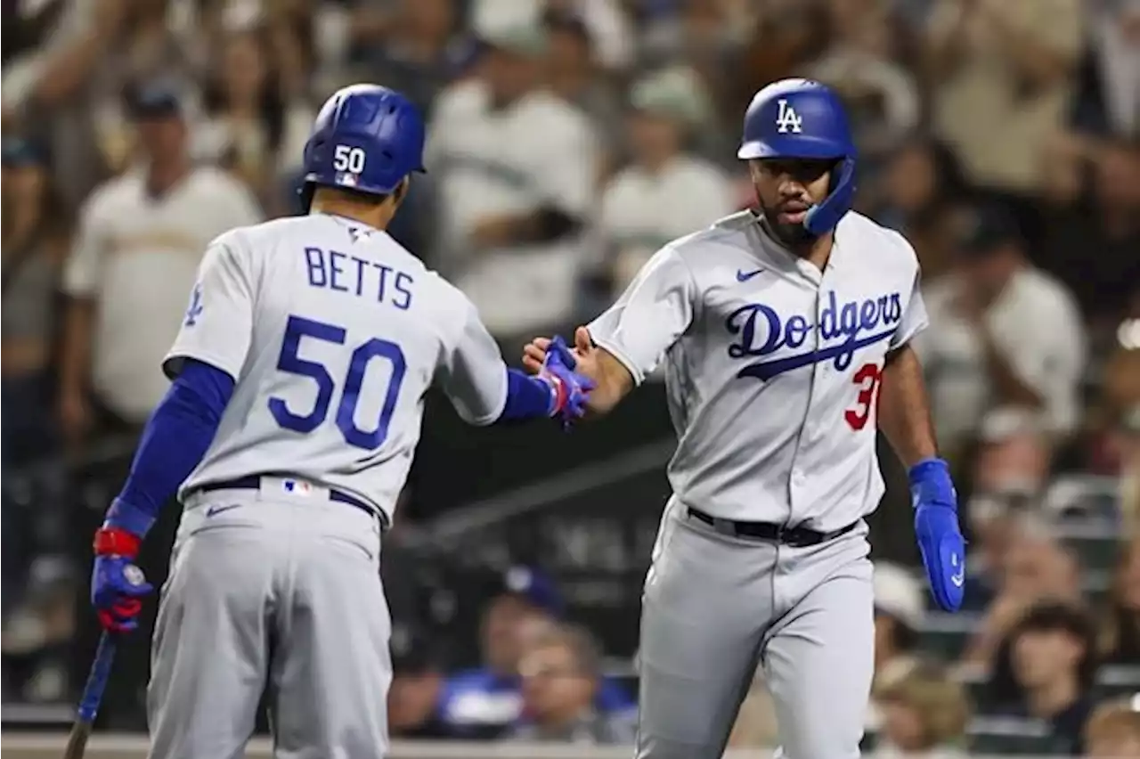 Dodgers wrap up NL West title for 10th time in 11 years with 6-2 win over Mariners in 11 innings