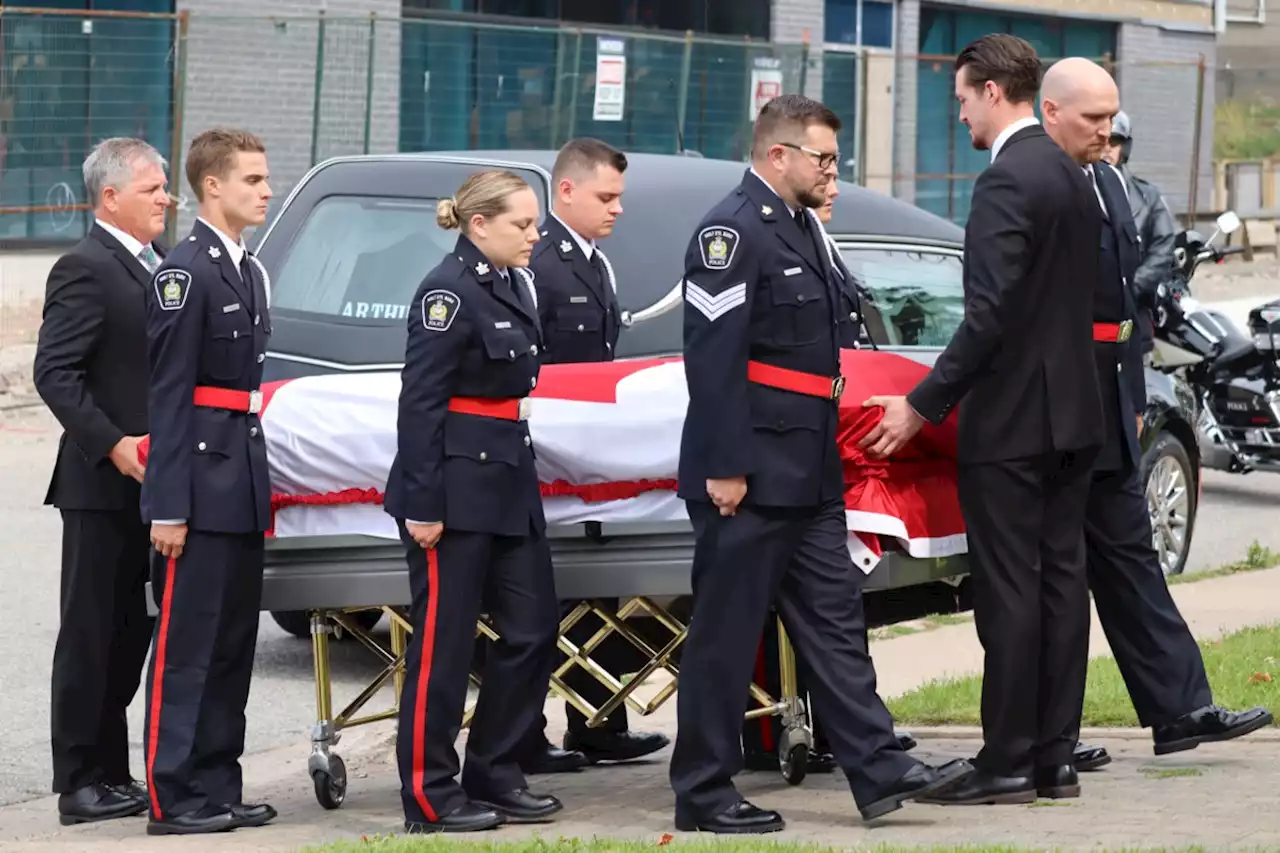 GALLERY: Tears shed as funeral for local officer draws hundreds