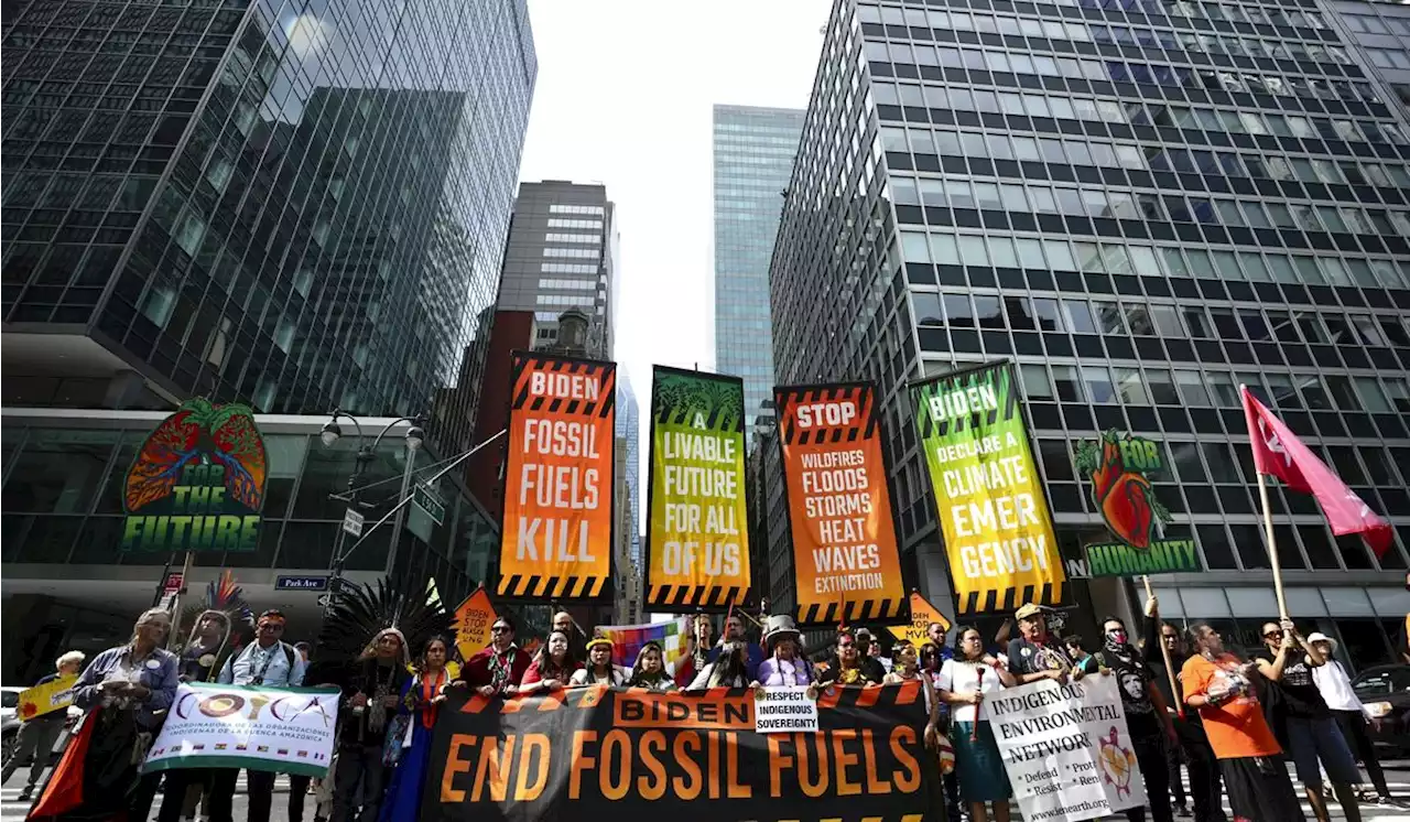 Thousands march to kick off climate summit, demanding an end to warming-causing fossil fuels