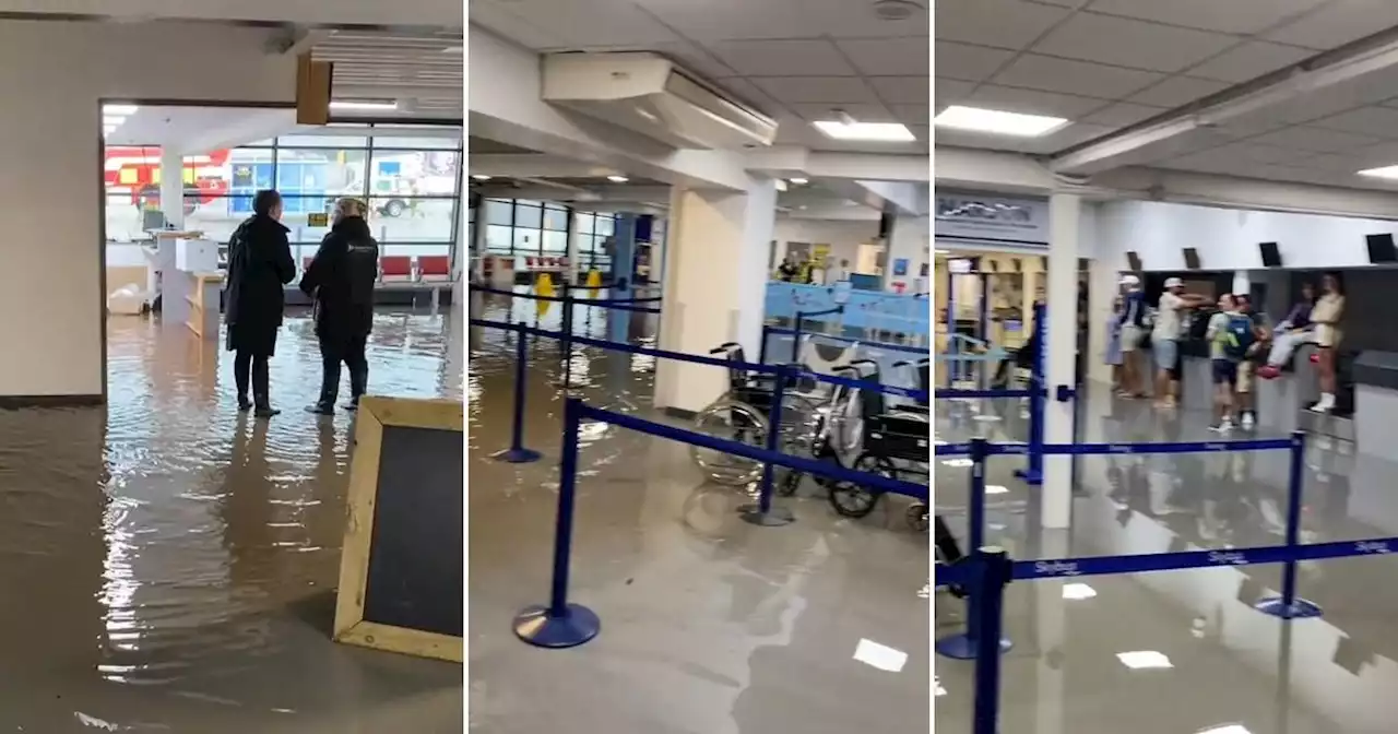 UK airport forced to close after flooding left passengers wading through water