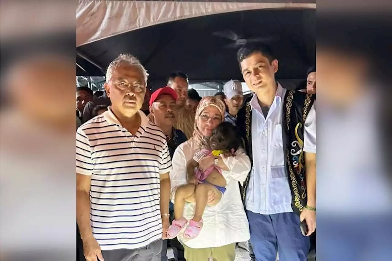 Toddler with facial hair, no nostrils, captures Malaysian King and Queen’s attention