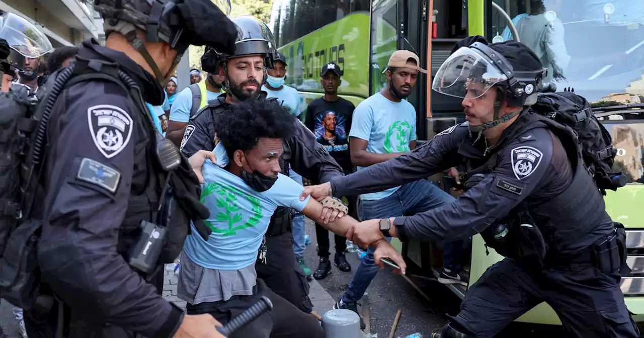 Dozens of police injured as clashes erupt among rival Eritrean groups in Israel