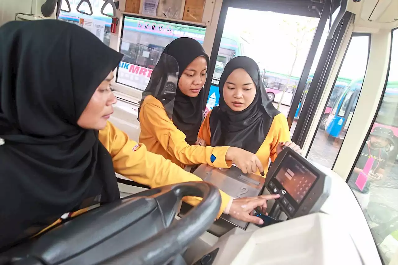 Family of three women bus captains take the driver seat